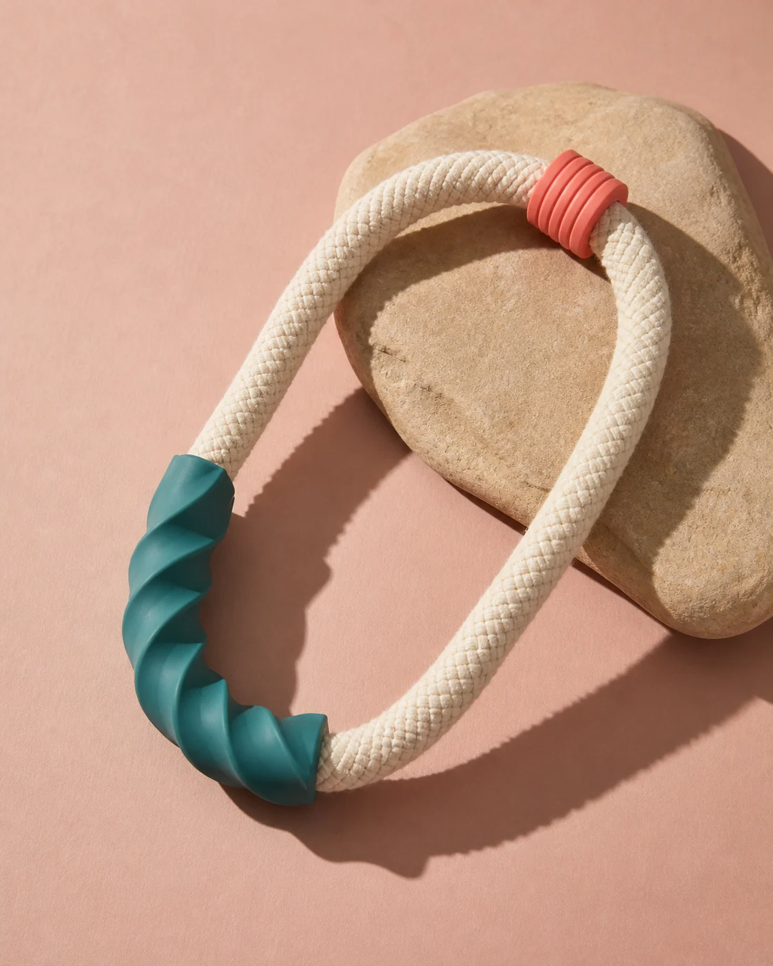 Cotton rope Loop Tug with teal rubber grip on a blush studio backdrop