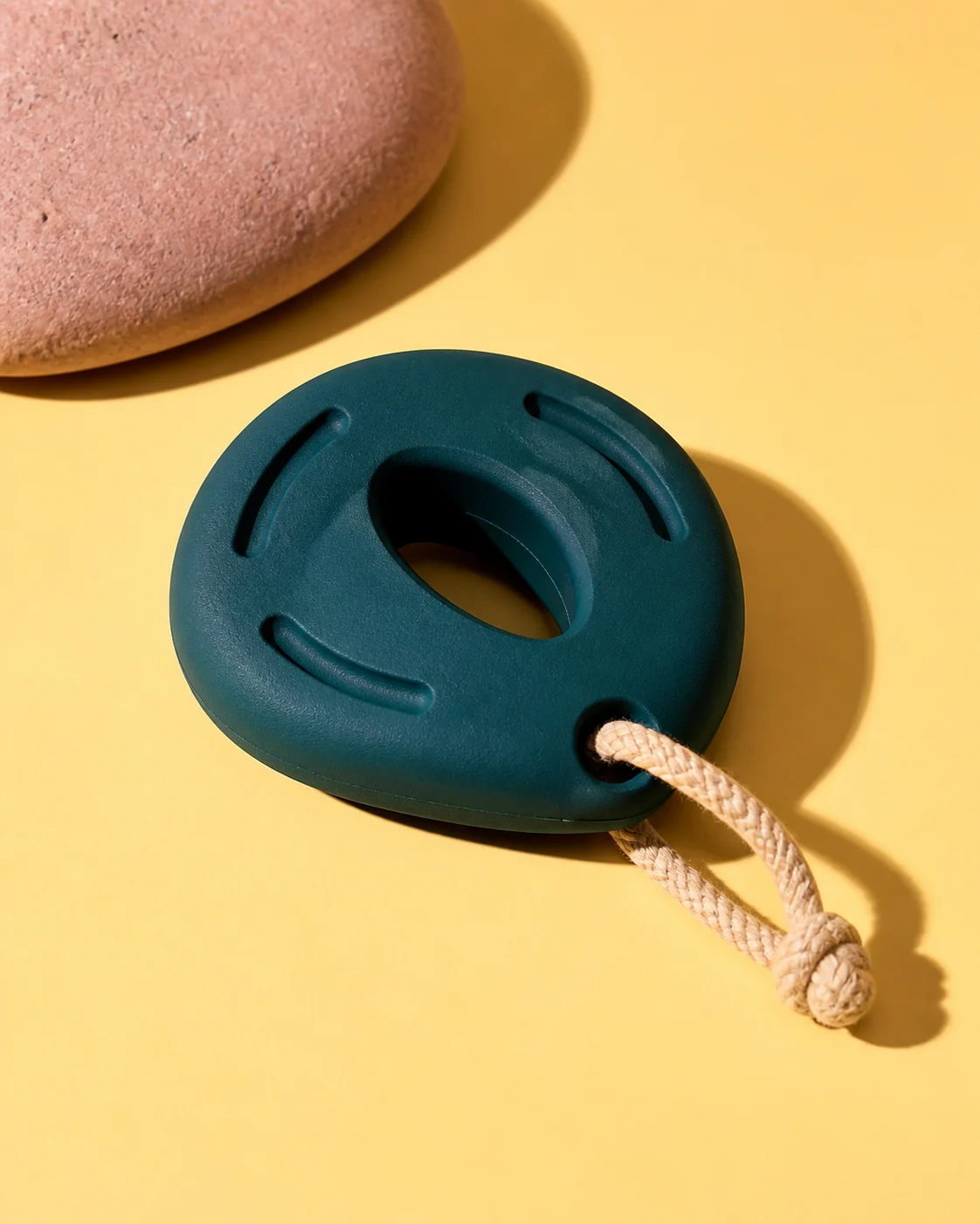 Deep teal natural-rubber Pebble Chew with a cotton loop